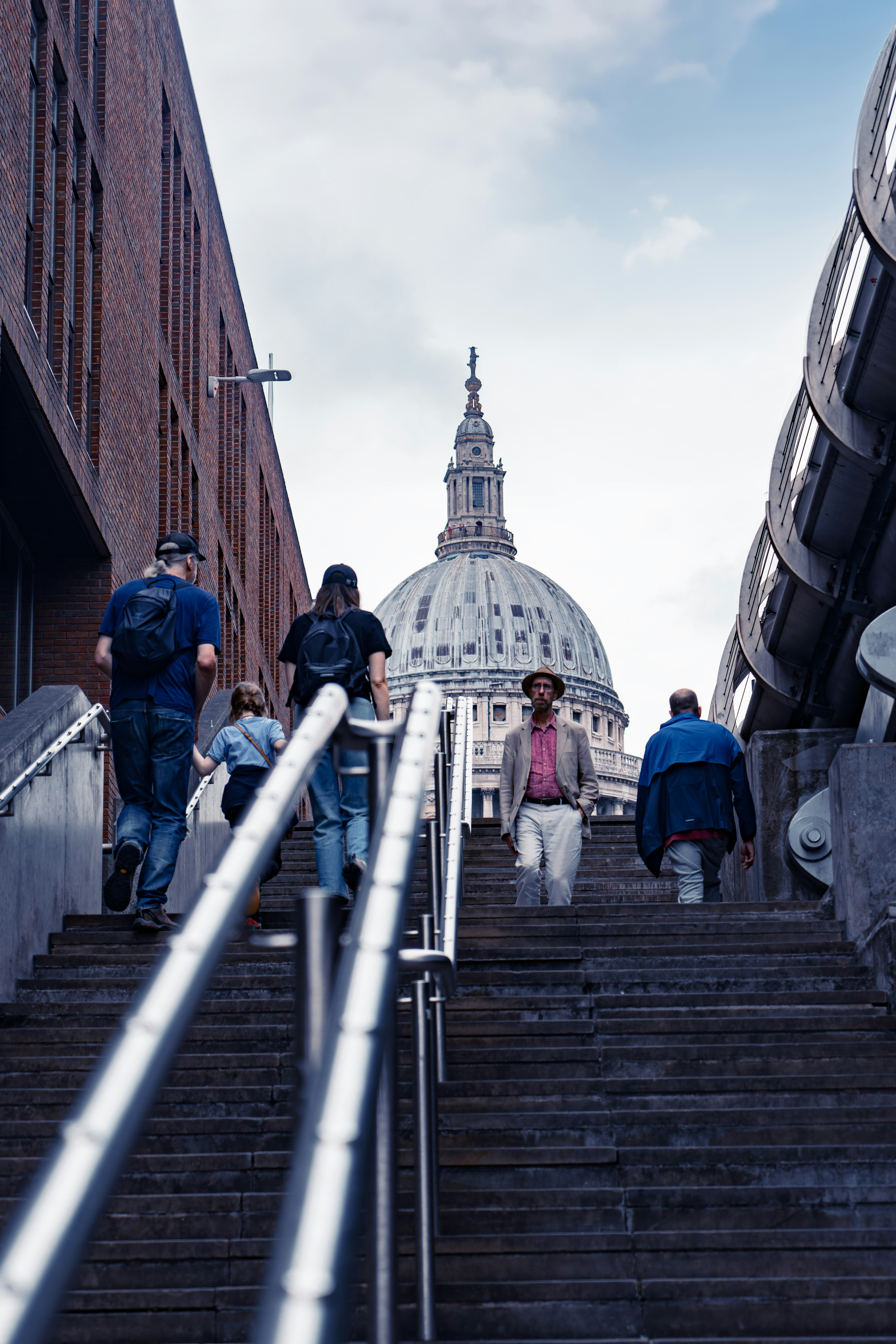 A group of people walking down a flight of stairs