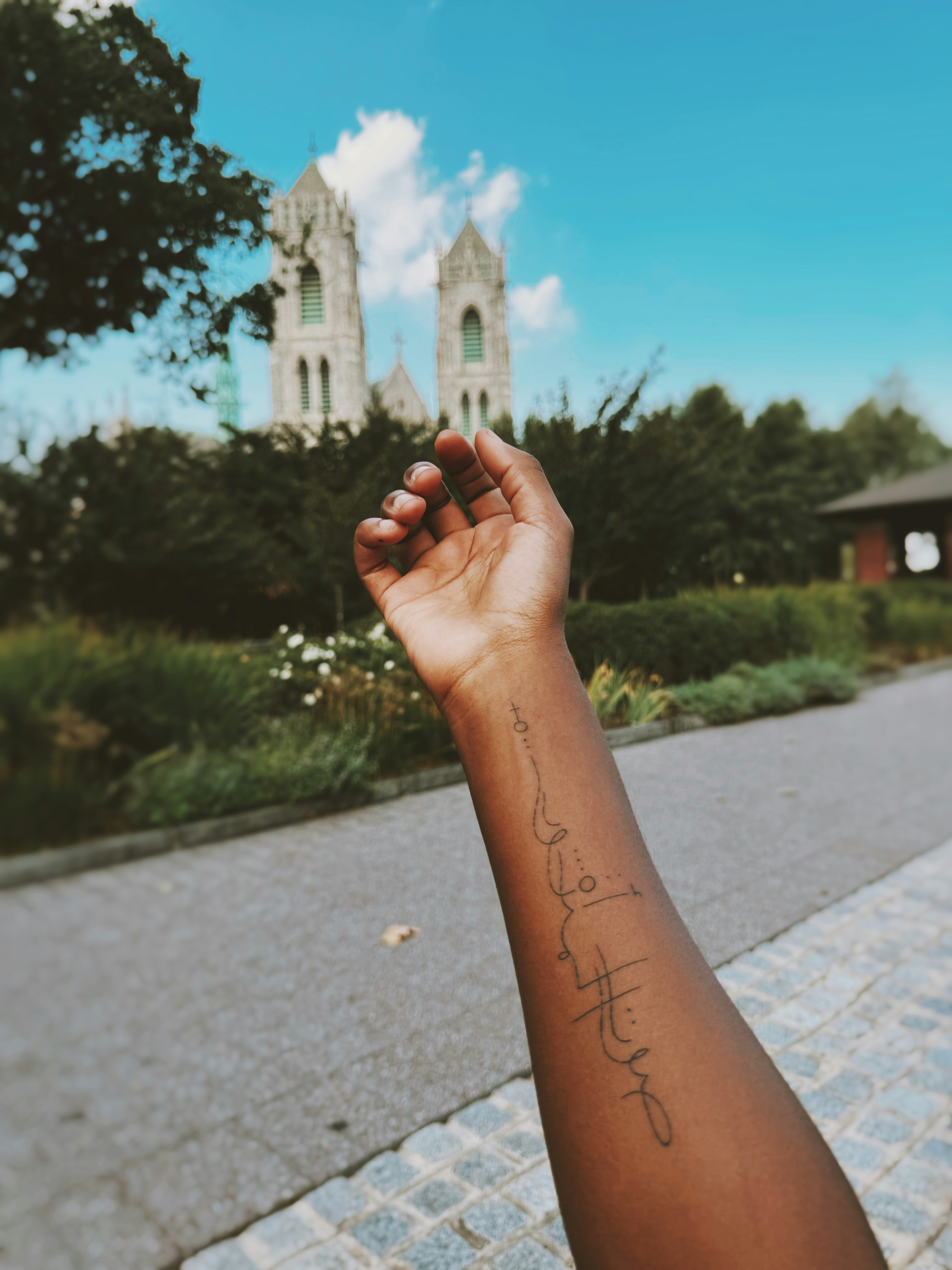A person with a small tattoo on their arm
