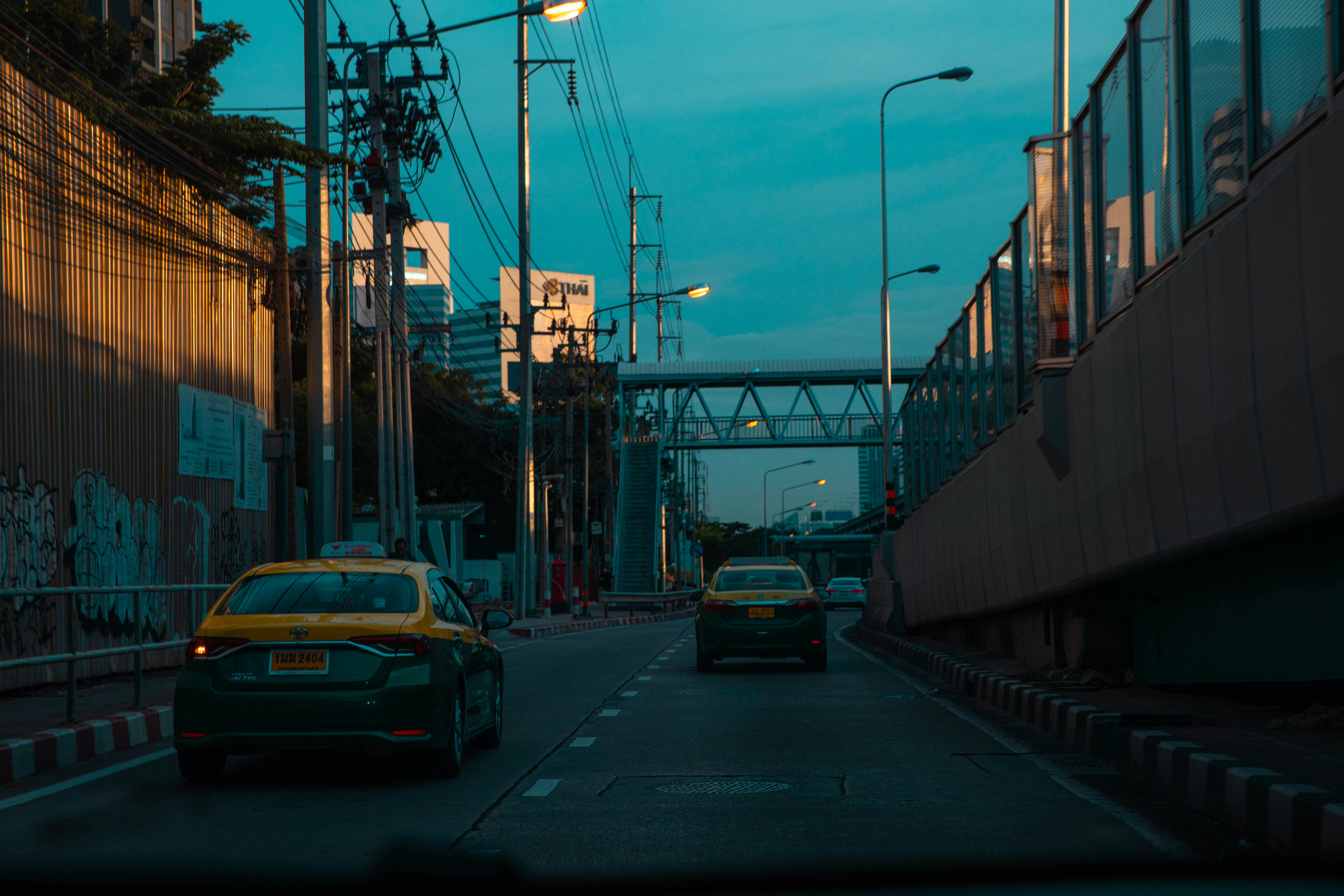 A couple of cars that are sitting in the street