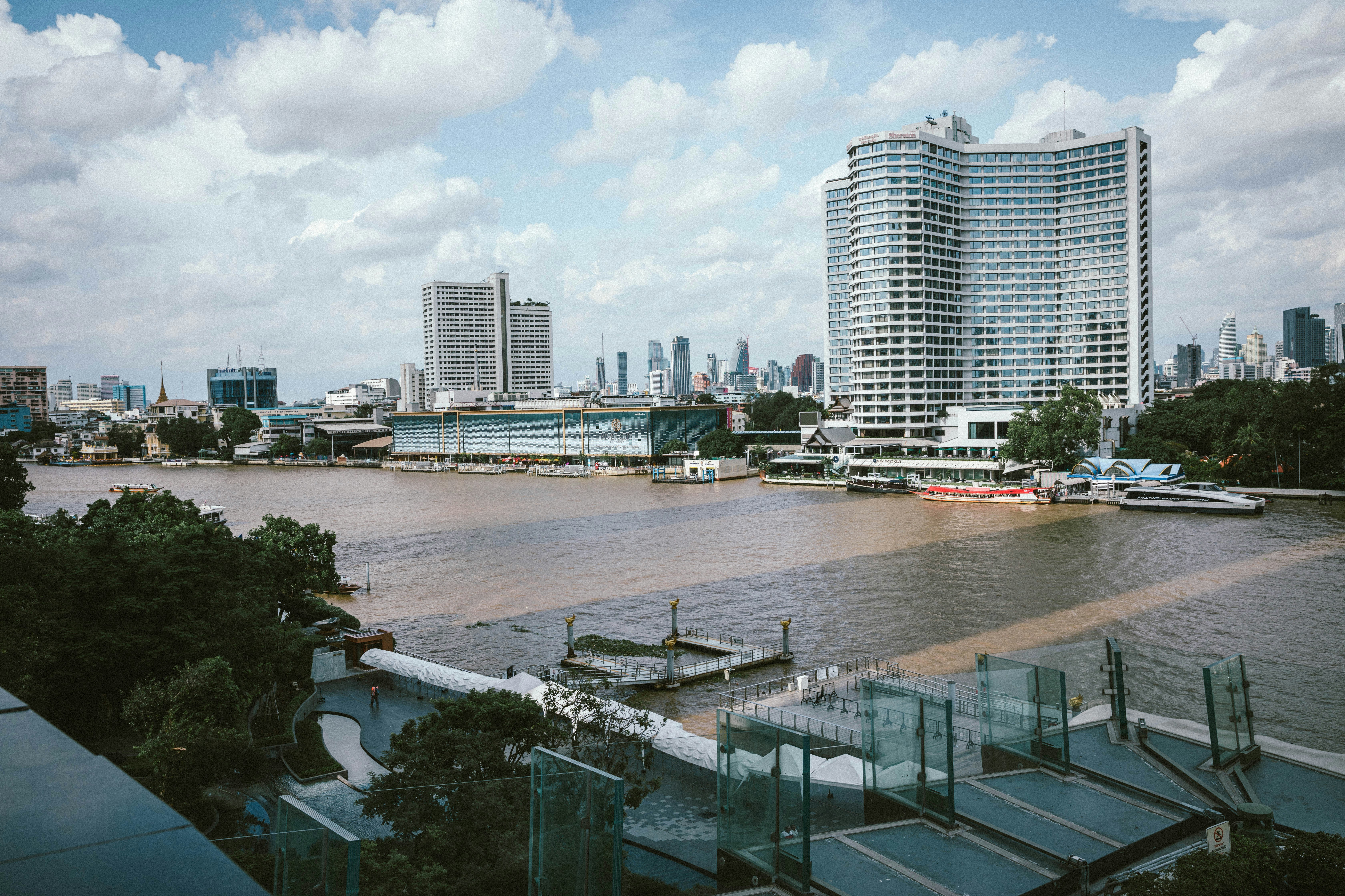A view of a body of water with a city in the background
