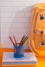 A yellow backpack sitting on top of a table