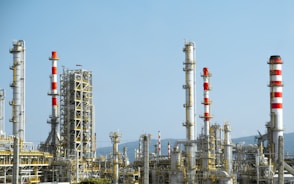 A factory with a lot of red and white pipes