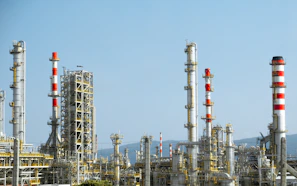 A factory with a lot of red and white pipes