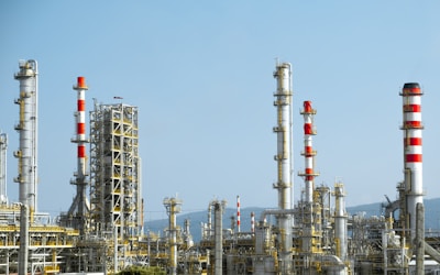 A factory with a lot of red and white pipes