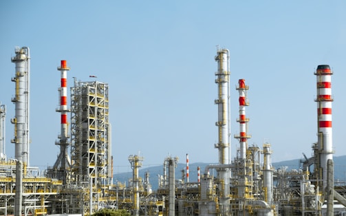 A factory with a lot of red and white pipes