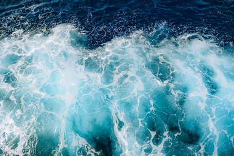 A large body of water covered in lots of blue water