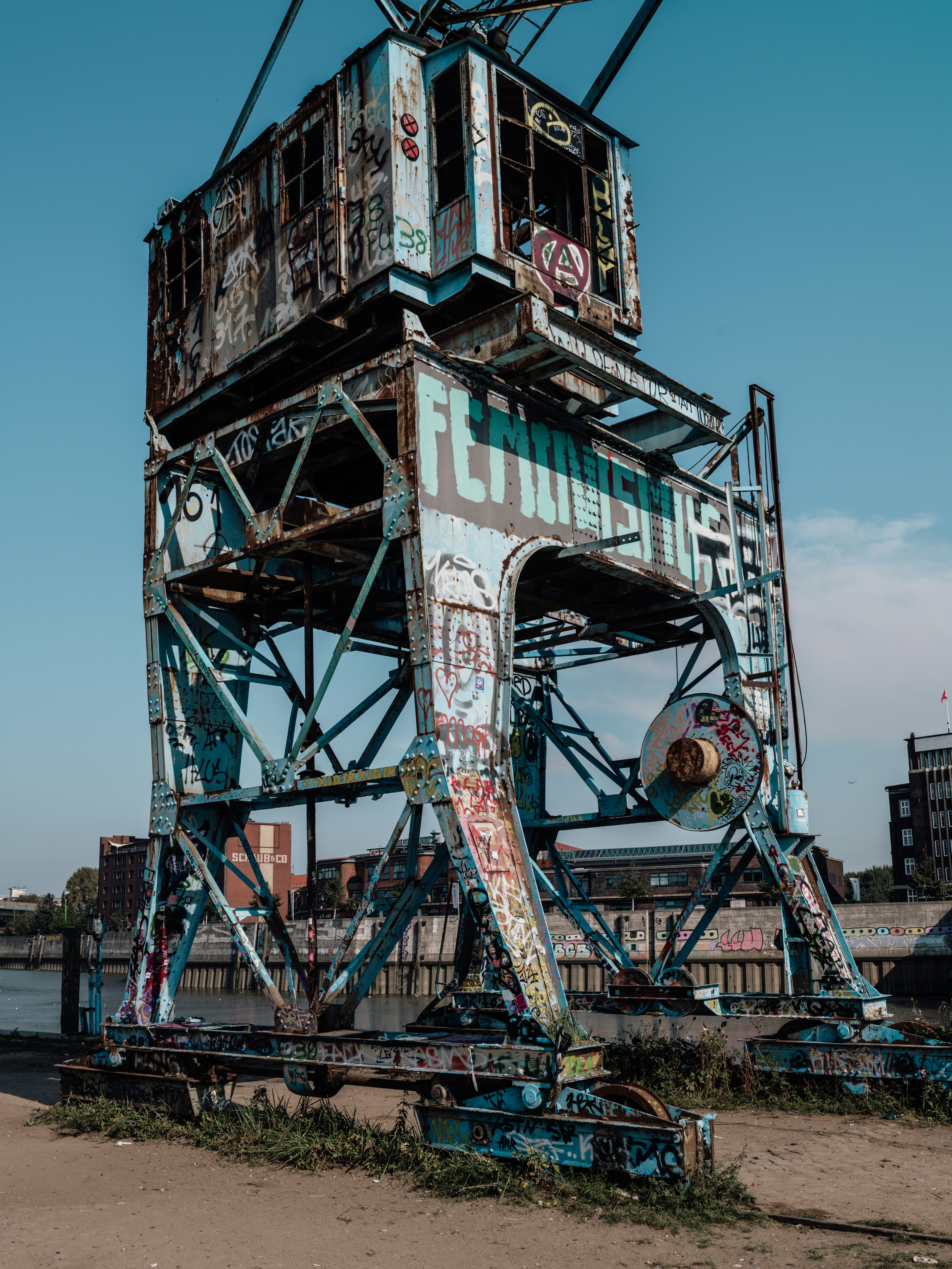 A very tall metal structure sitting on top of a beach