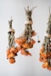 A bunch of dried flowers hanging from a ceiling