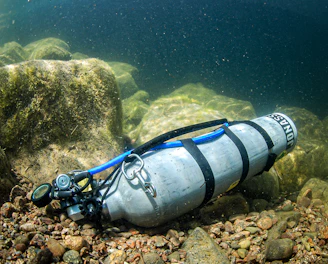 A diving device is laying on the rocks