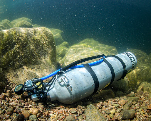 A diving device is laying on the rocks