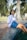 A woman sitting on the edge of a swimming pool