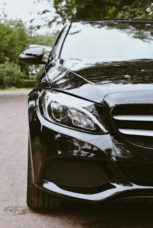 A black car parked on the side of the road