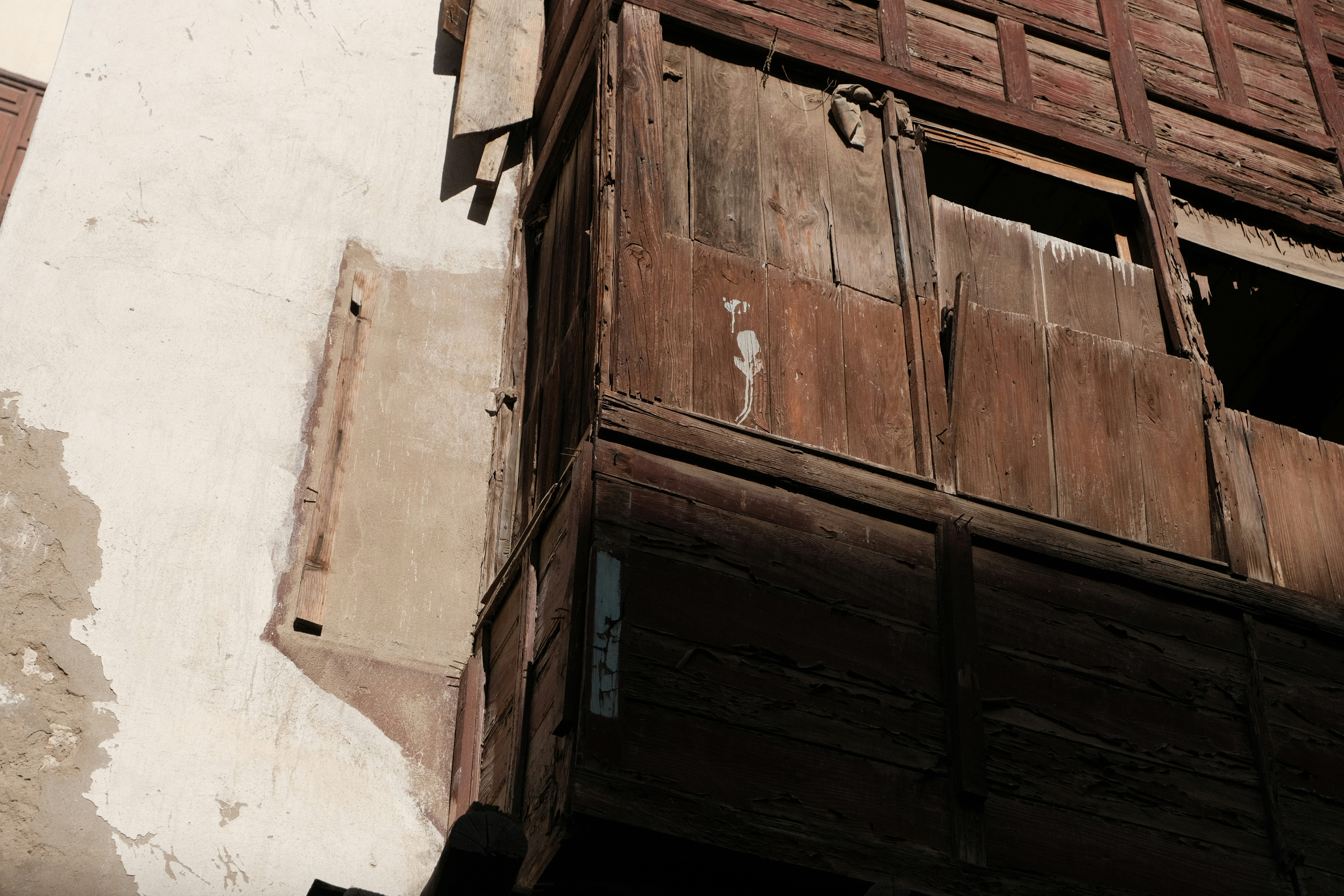 woman wearing yellow long-sleeved dress under white clouds and blue sky during daytime