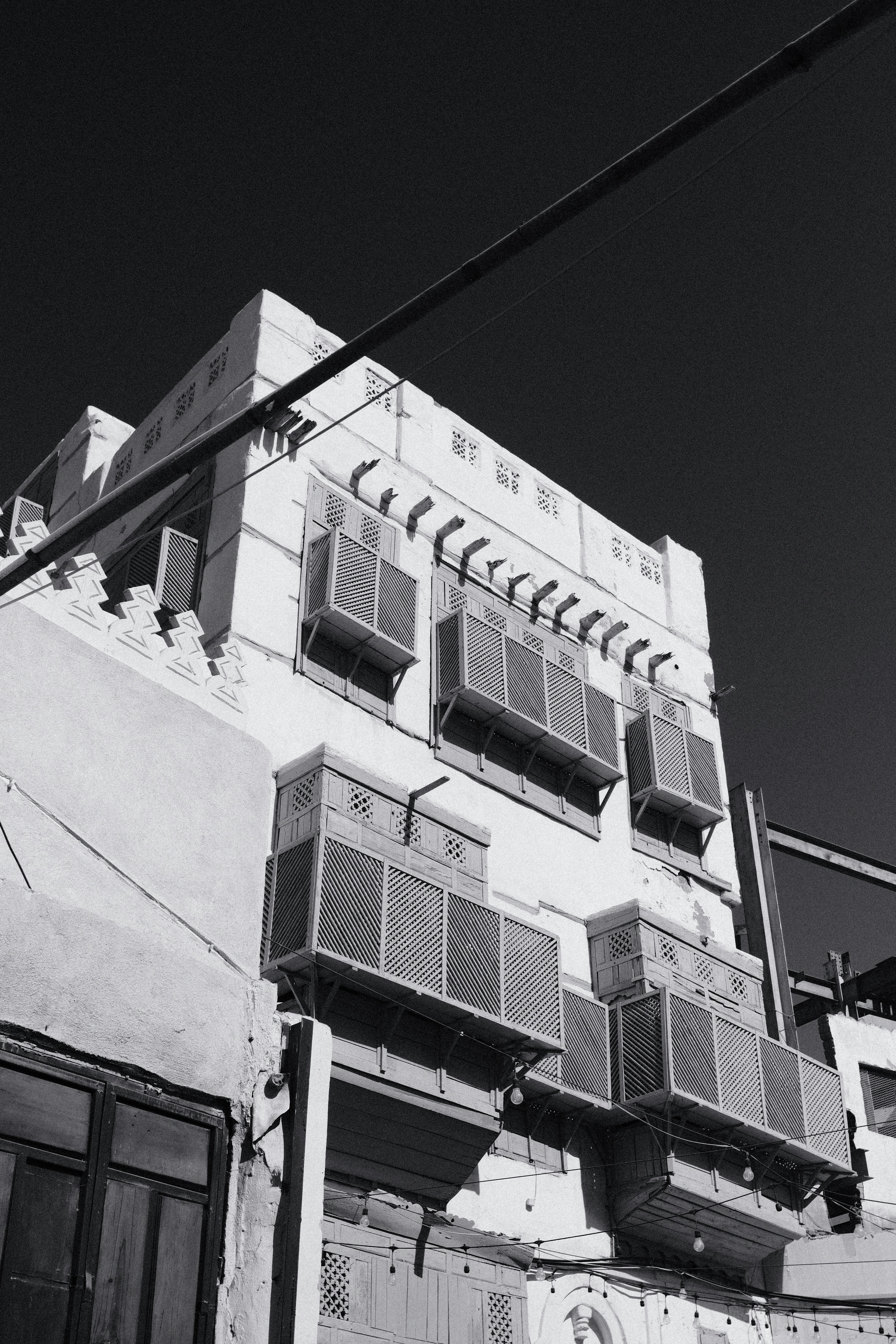 A black and white photo of an apartment building