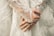 A close up of a person wearing a wedding dress