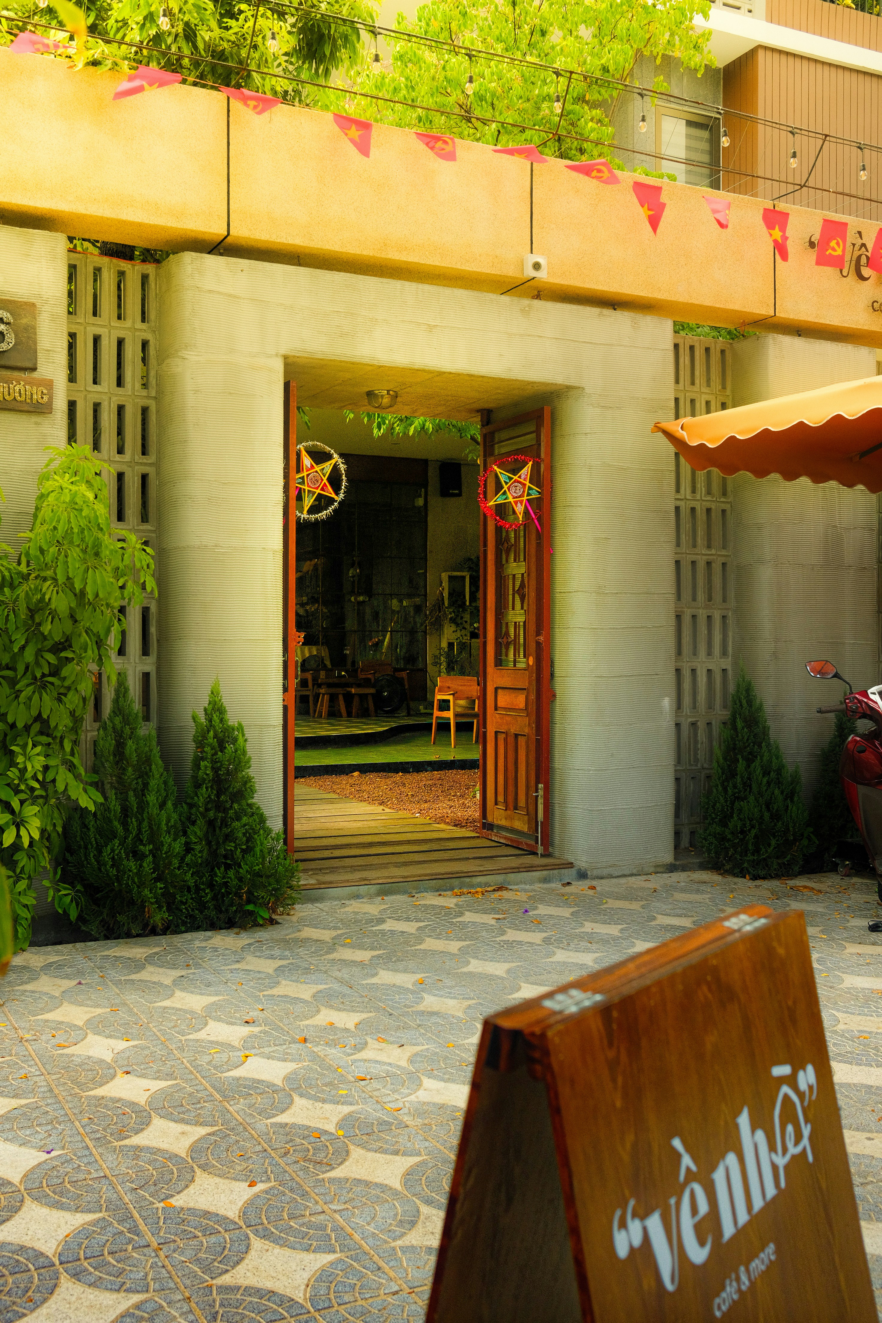 A restaurant with a sign in front of it