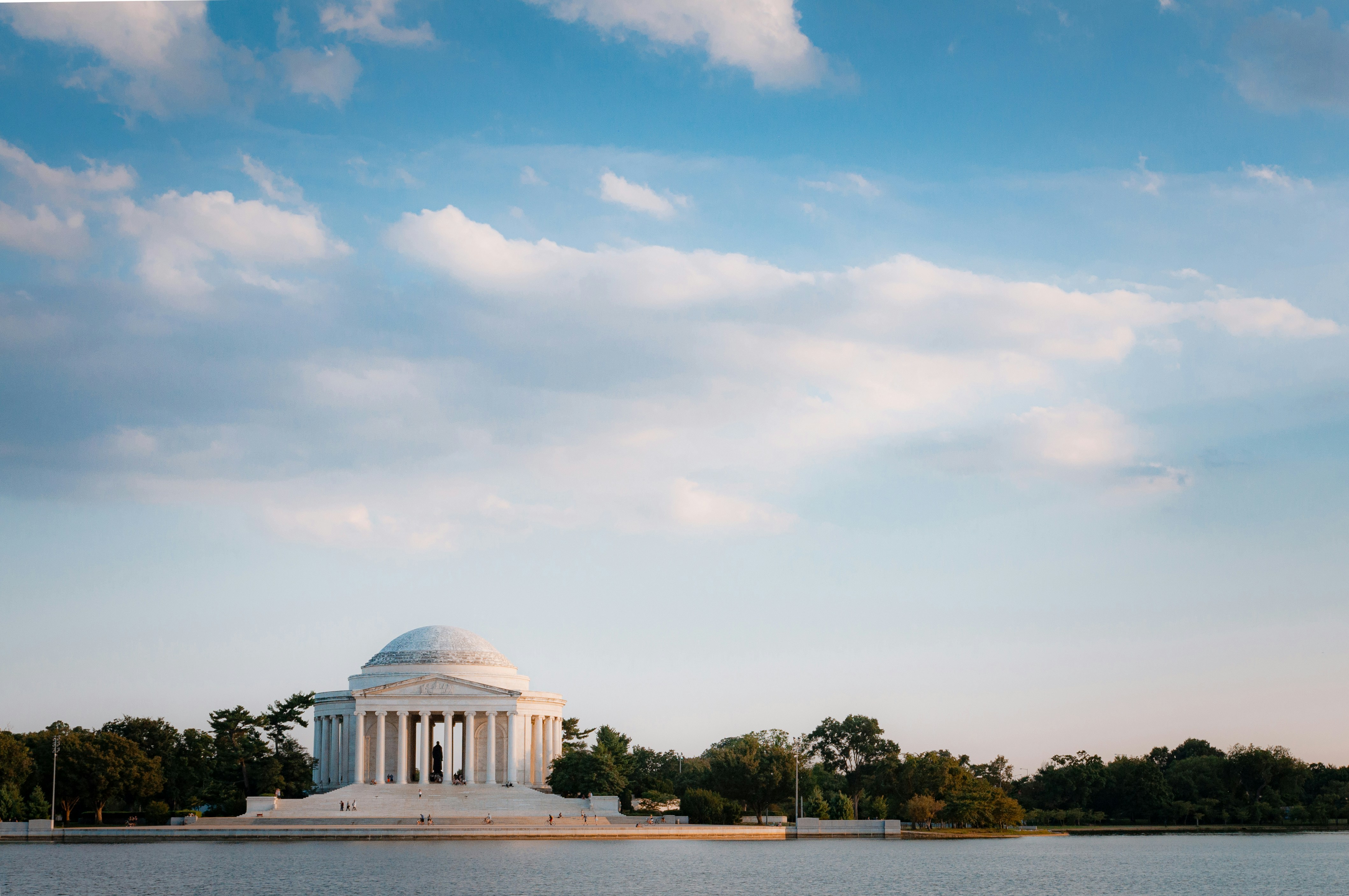 A large body of water with a white building in the background