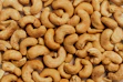 A pile of cashews sitting on top of a table