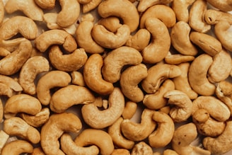 A pile of cashews sitting on top of a table