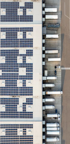An aerial view of a building with a lot of solar panels