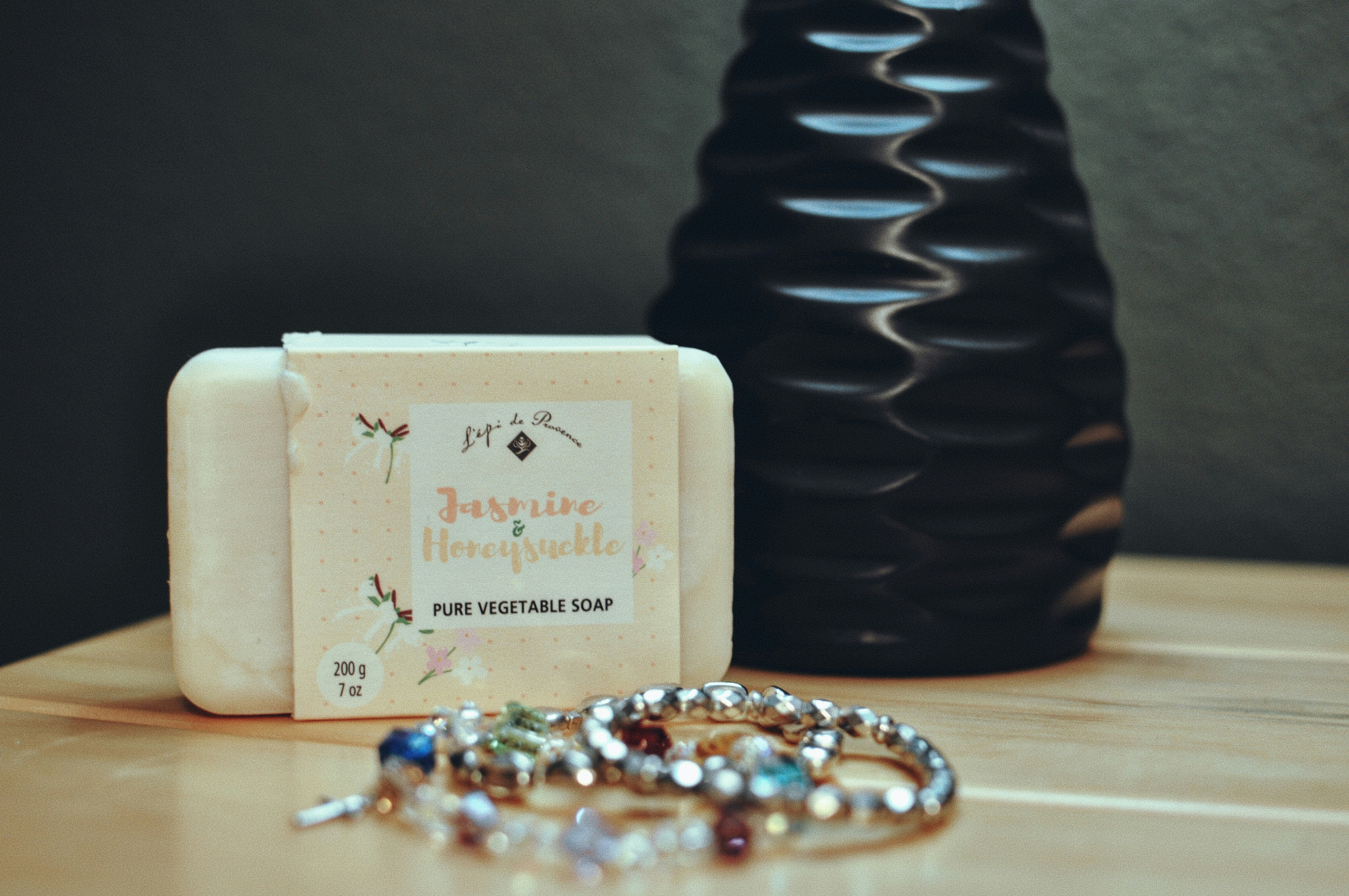 A couple of bracelets sitting on top of a wooden table