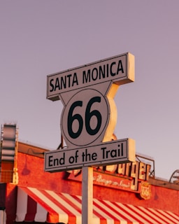 A close up of a street sign with a sky background
