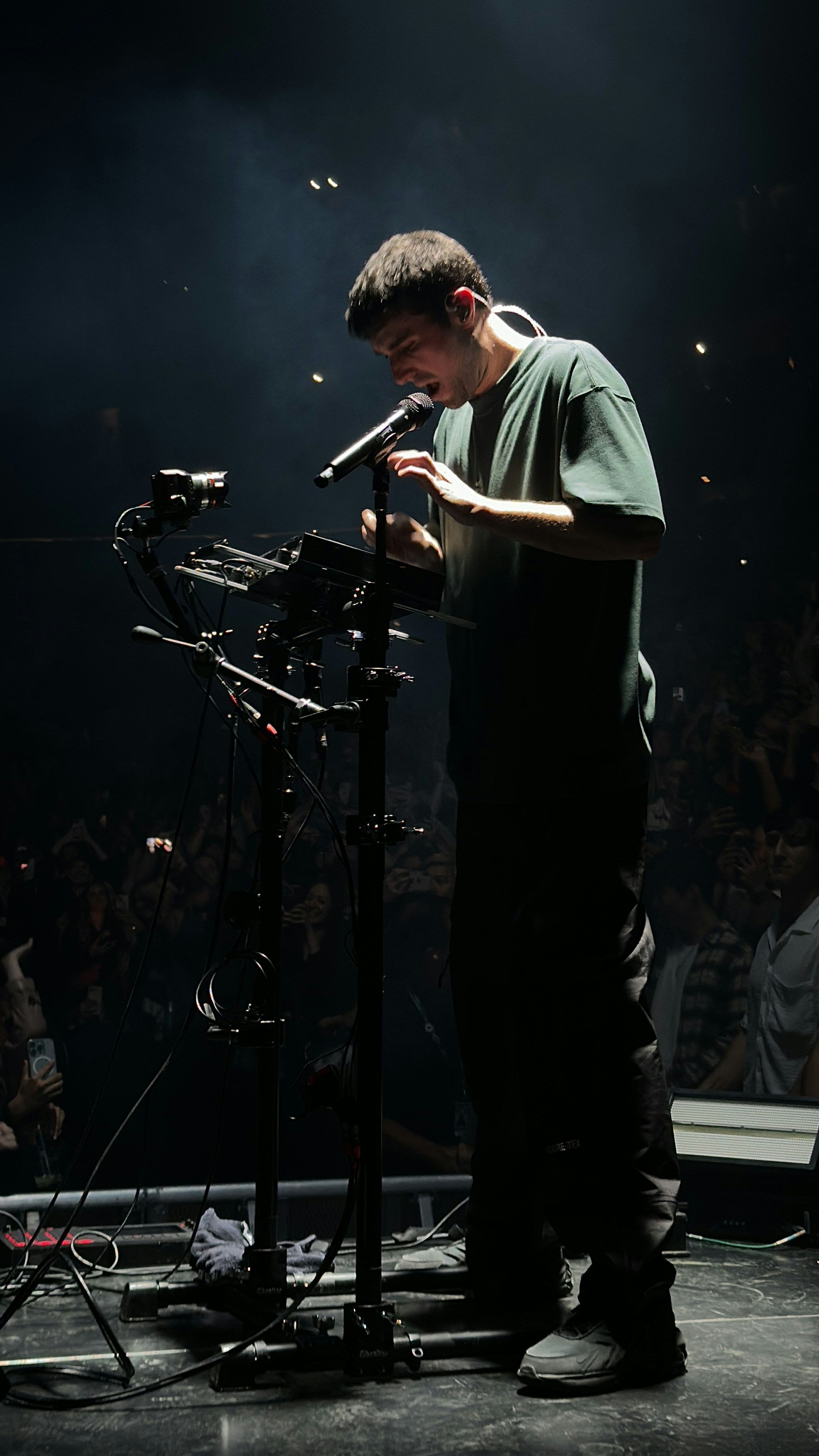 A man standing in front of a microphone on a stage