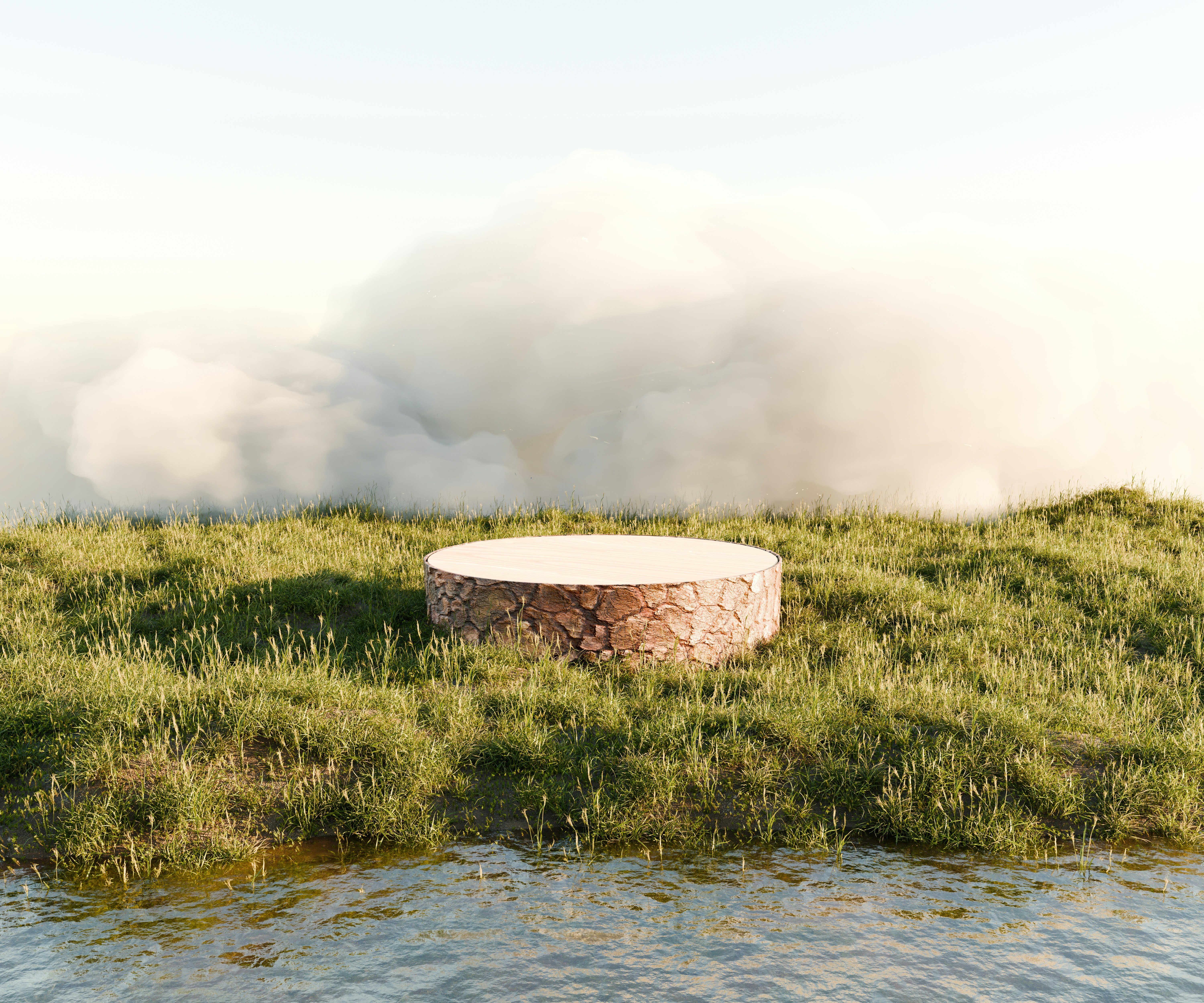 A fire pit sitting on top of a lush green field