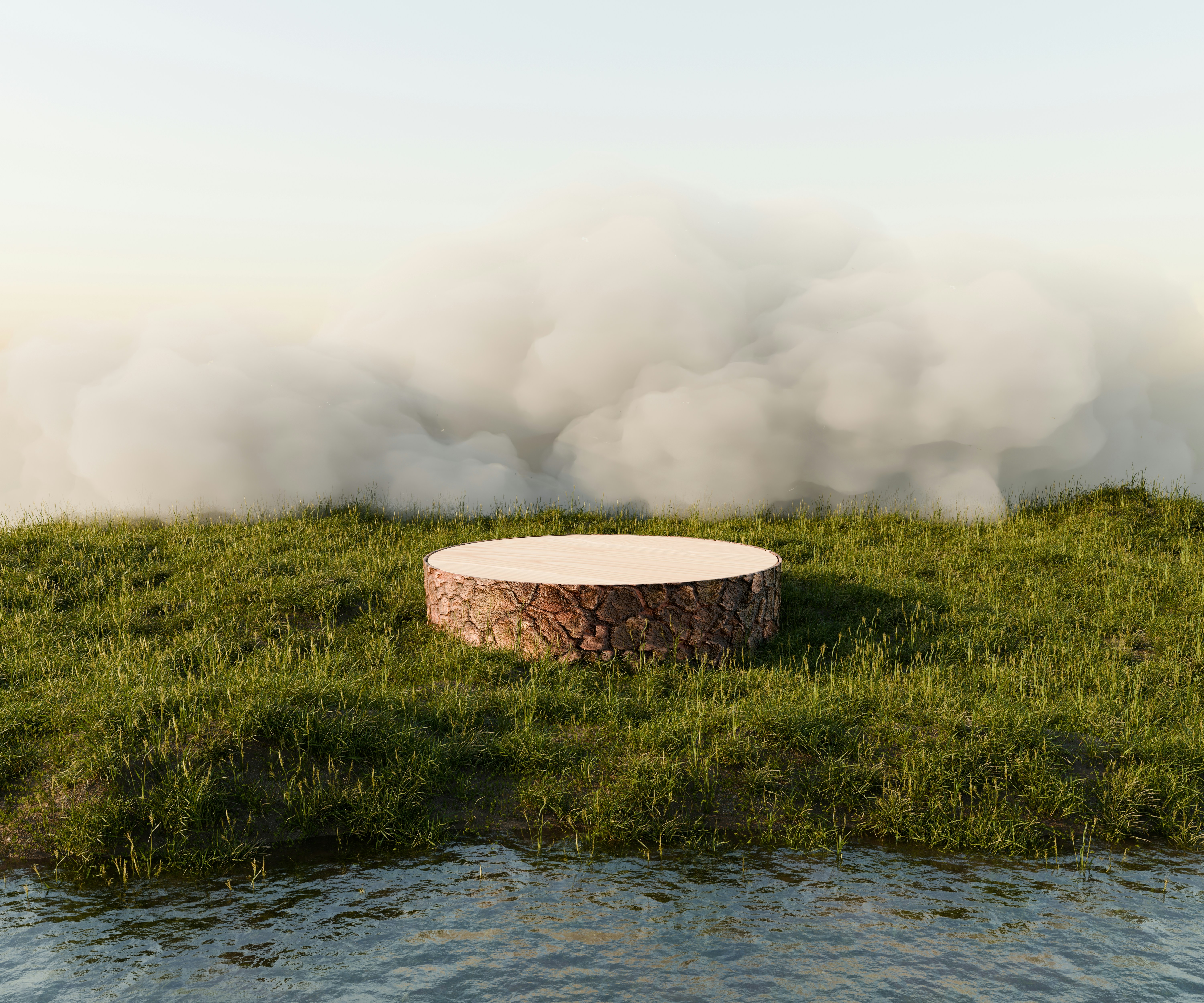 A fire pit sitting on top of a lush green field