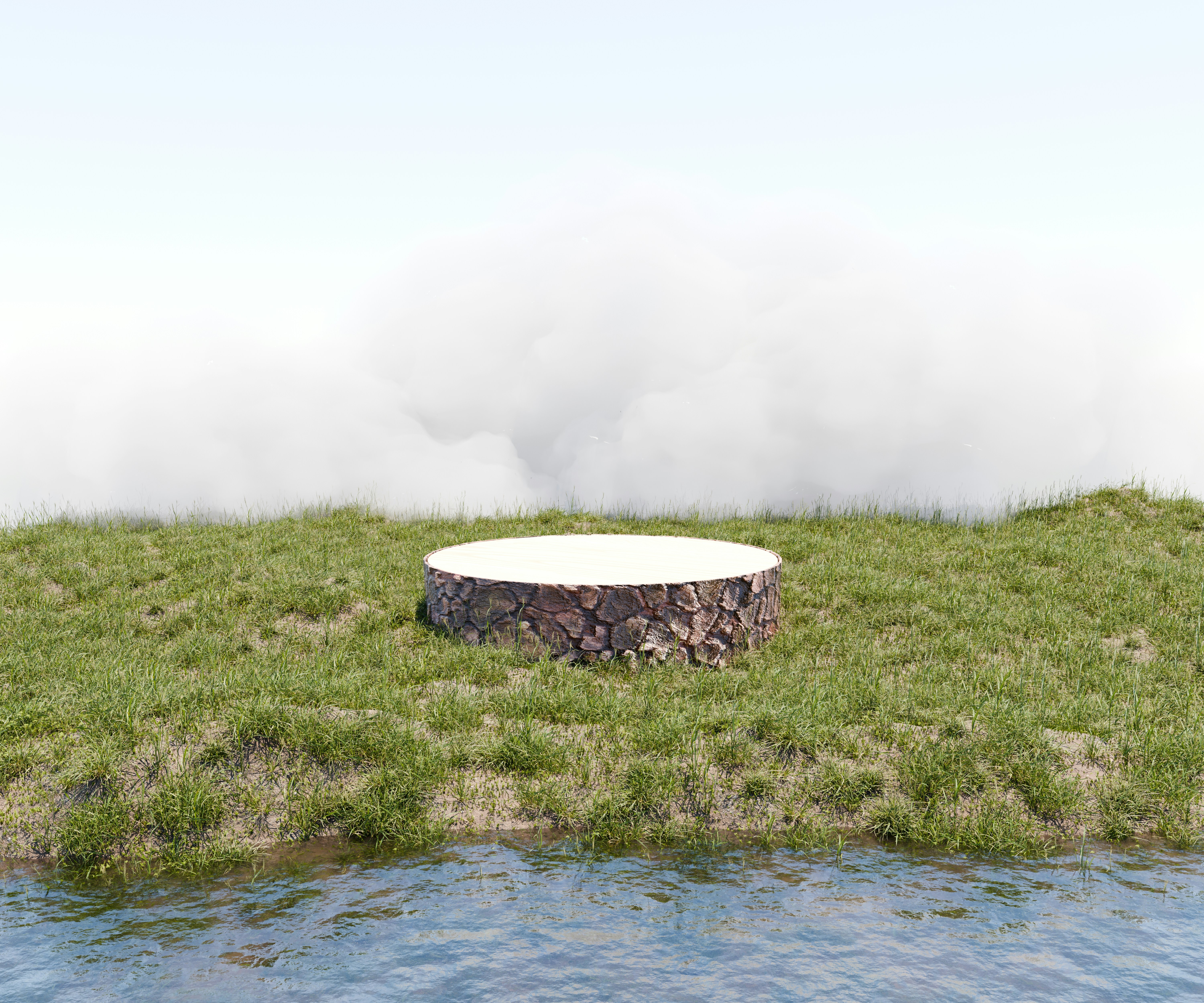 A stone bench sitting on top of a lush green field