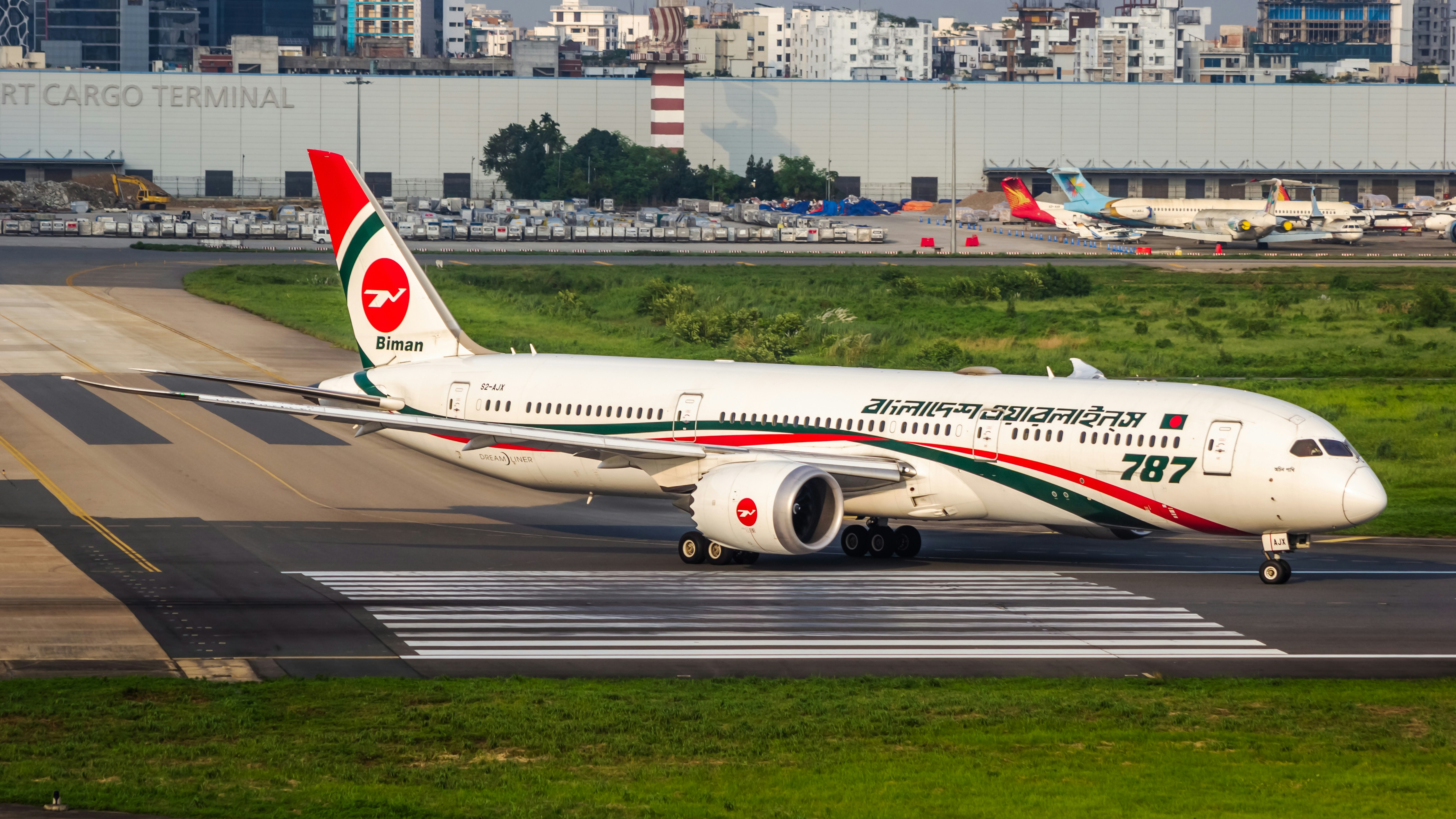 A large jetliner sitting on top of an airport runway, Biman Bangladesh Airlines Boeing 787-9