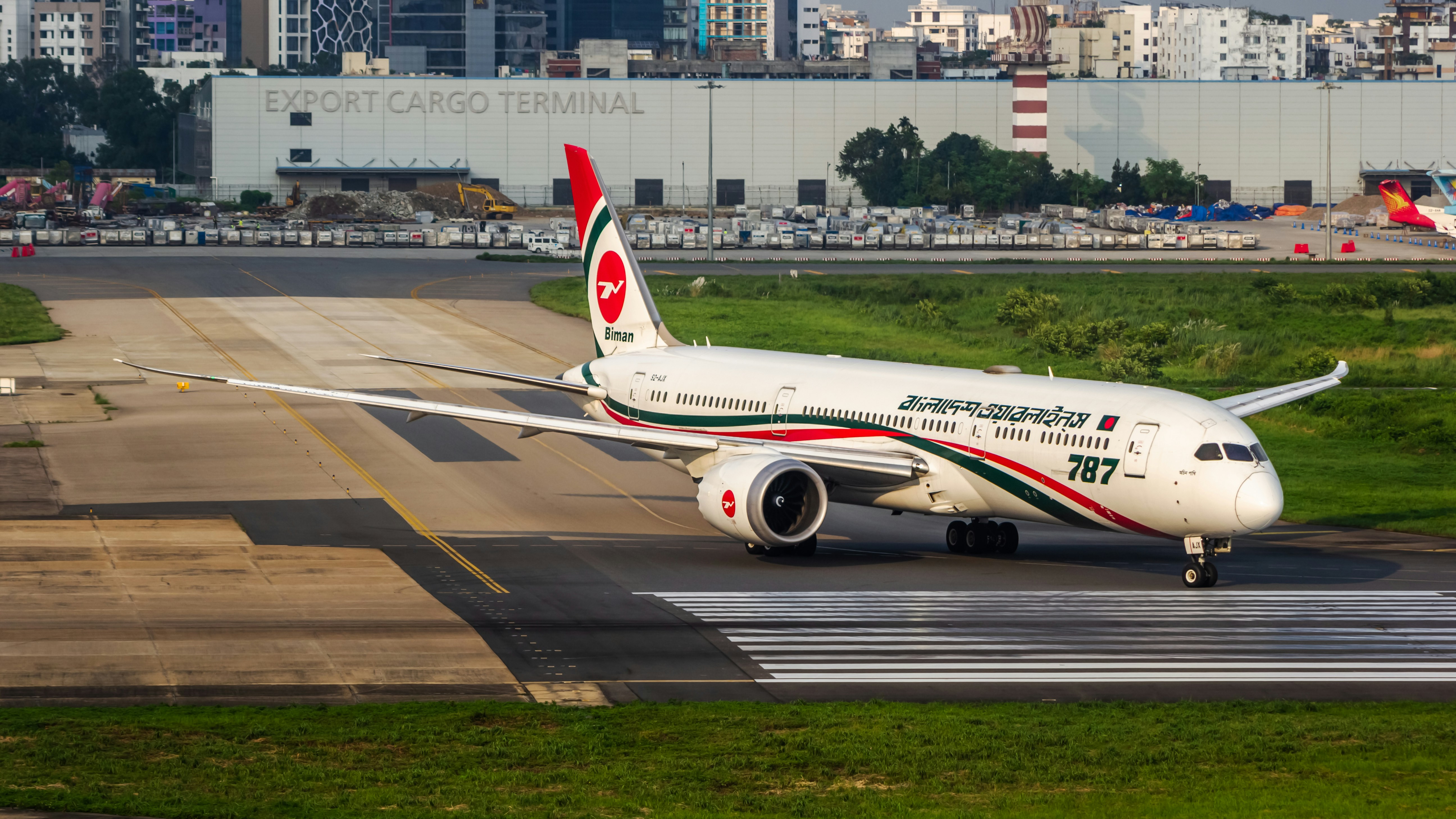 A large jetliner sitting on top of an airport runway, Biman Bangladesh Airlines Boeing 787-9