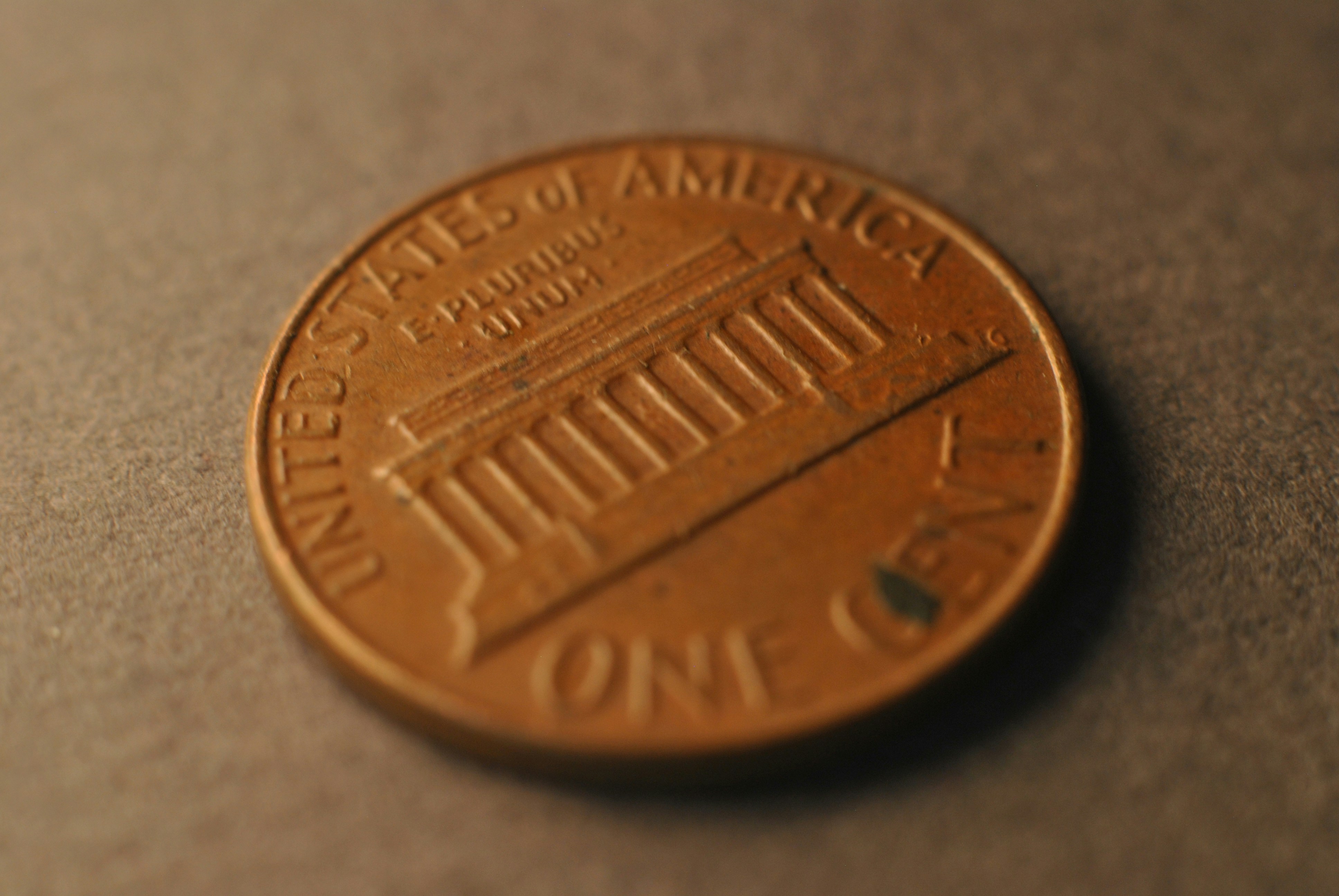 A close up of a penny on a table