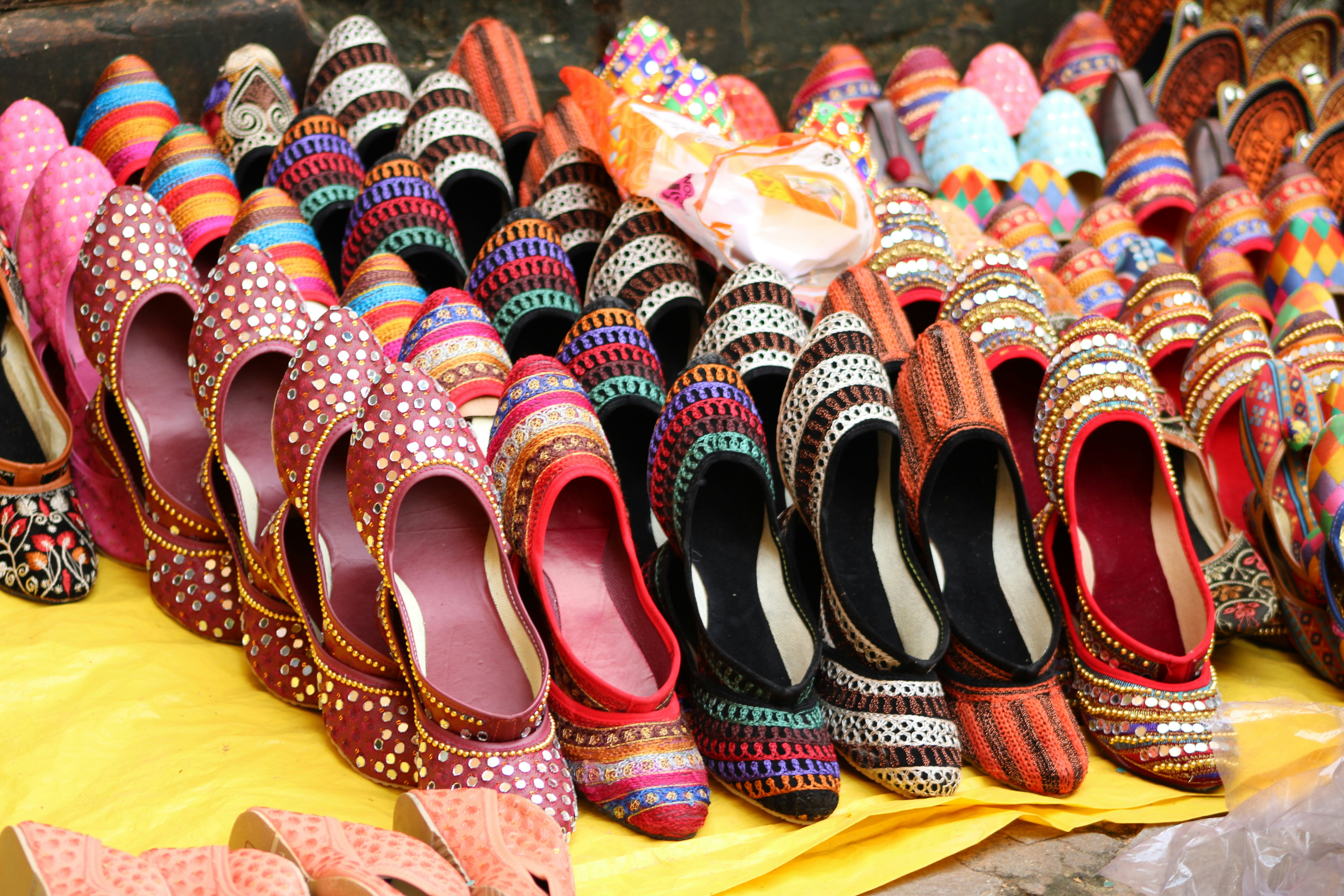 A bunch of shoes that are on a table
