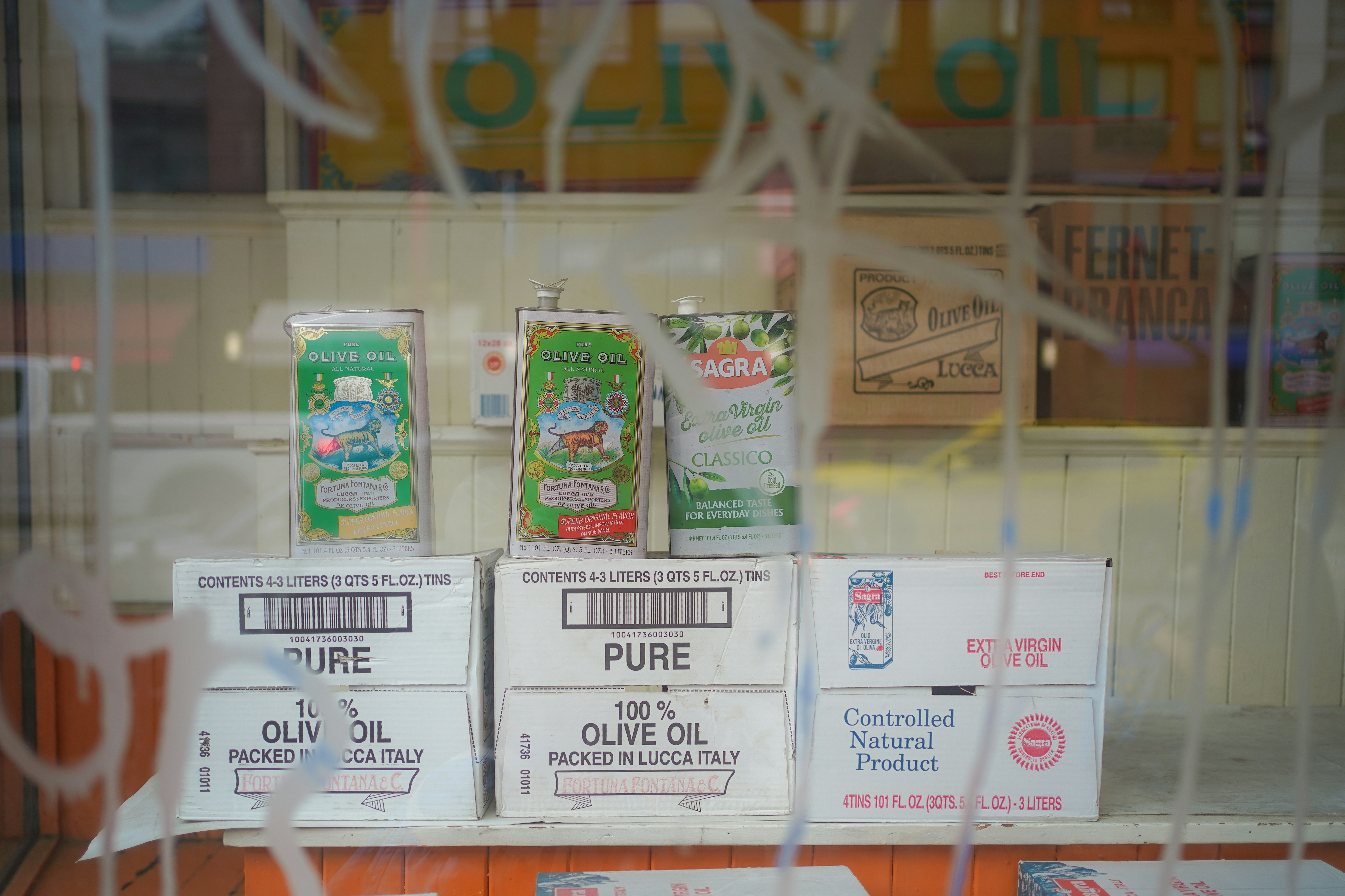 A store window with a bunch of items behind it