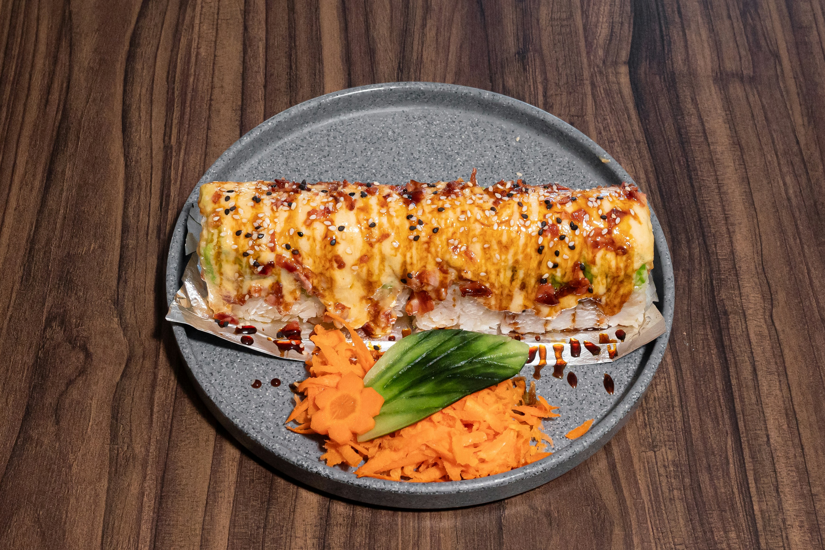 Rolls with orange sauce on a plate