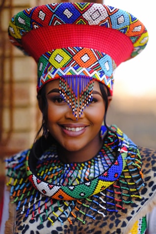 A woman wearing a colorful hat and scarf