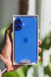 A person holding an iPhone in their hand
