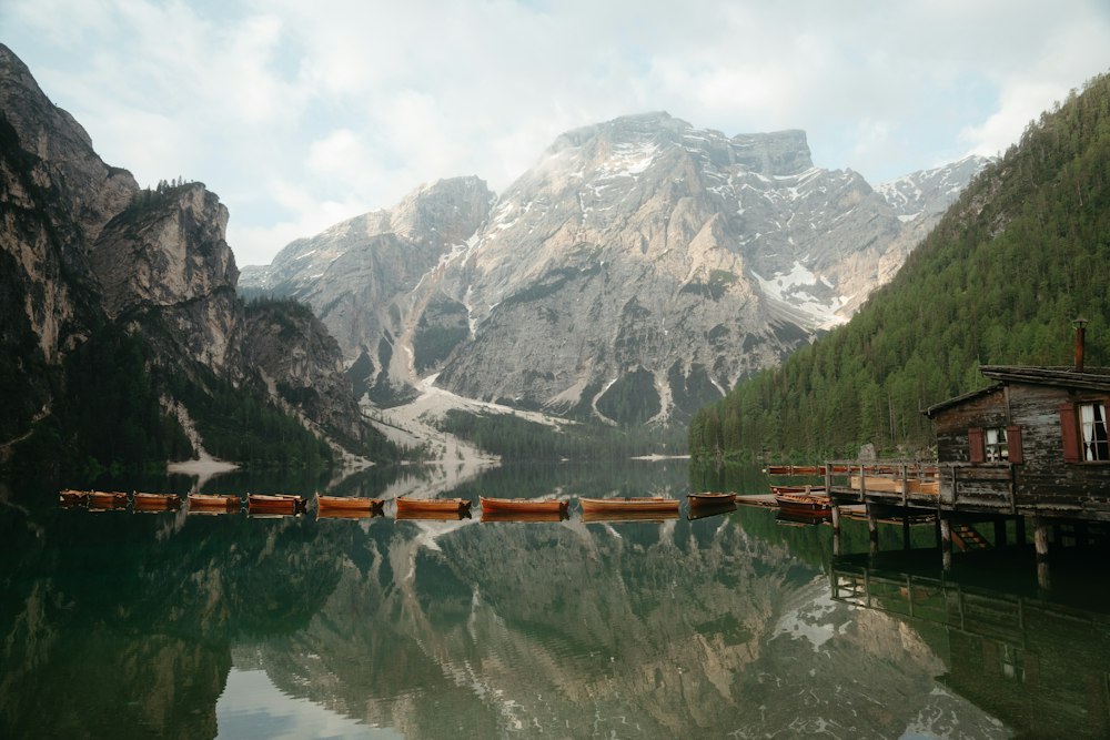 Lago di Braies at sunrise surrounded by pine forest and Dolomite peaks in Northern Italy