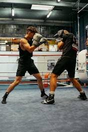 A couple of men standing in a boxing ring