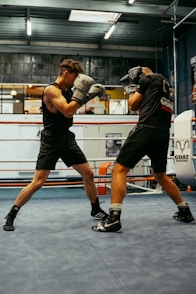 A couple of men standing in a boxing ring