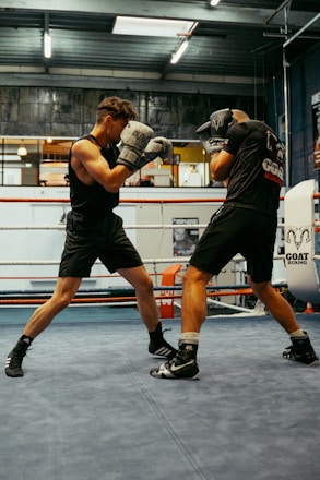 A couple of men standing in a boxing ring