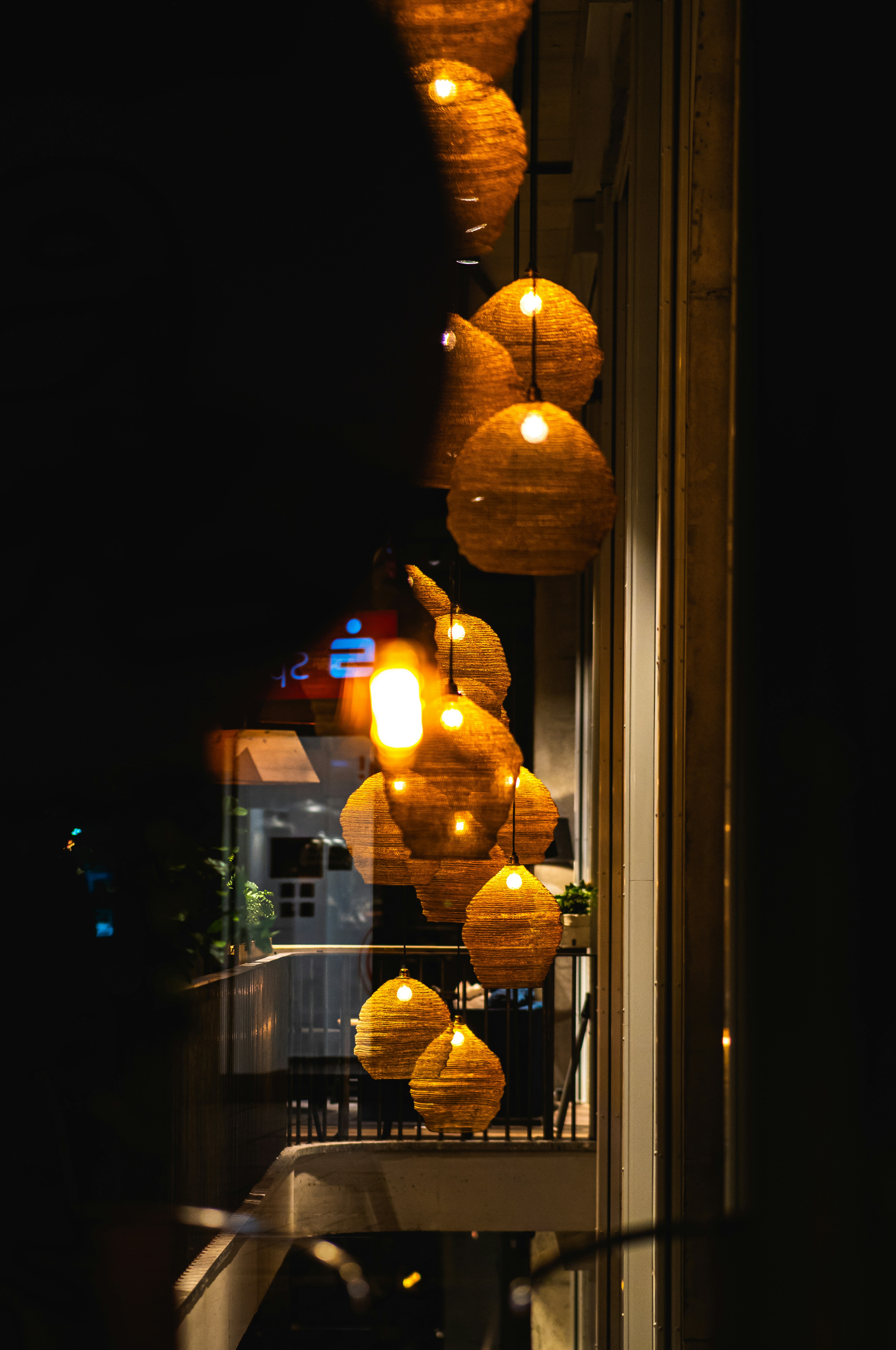 A number of lights hanging from a building