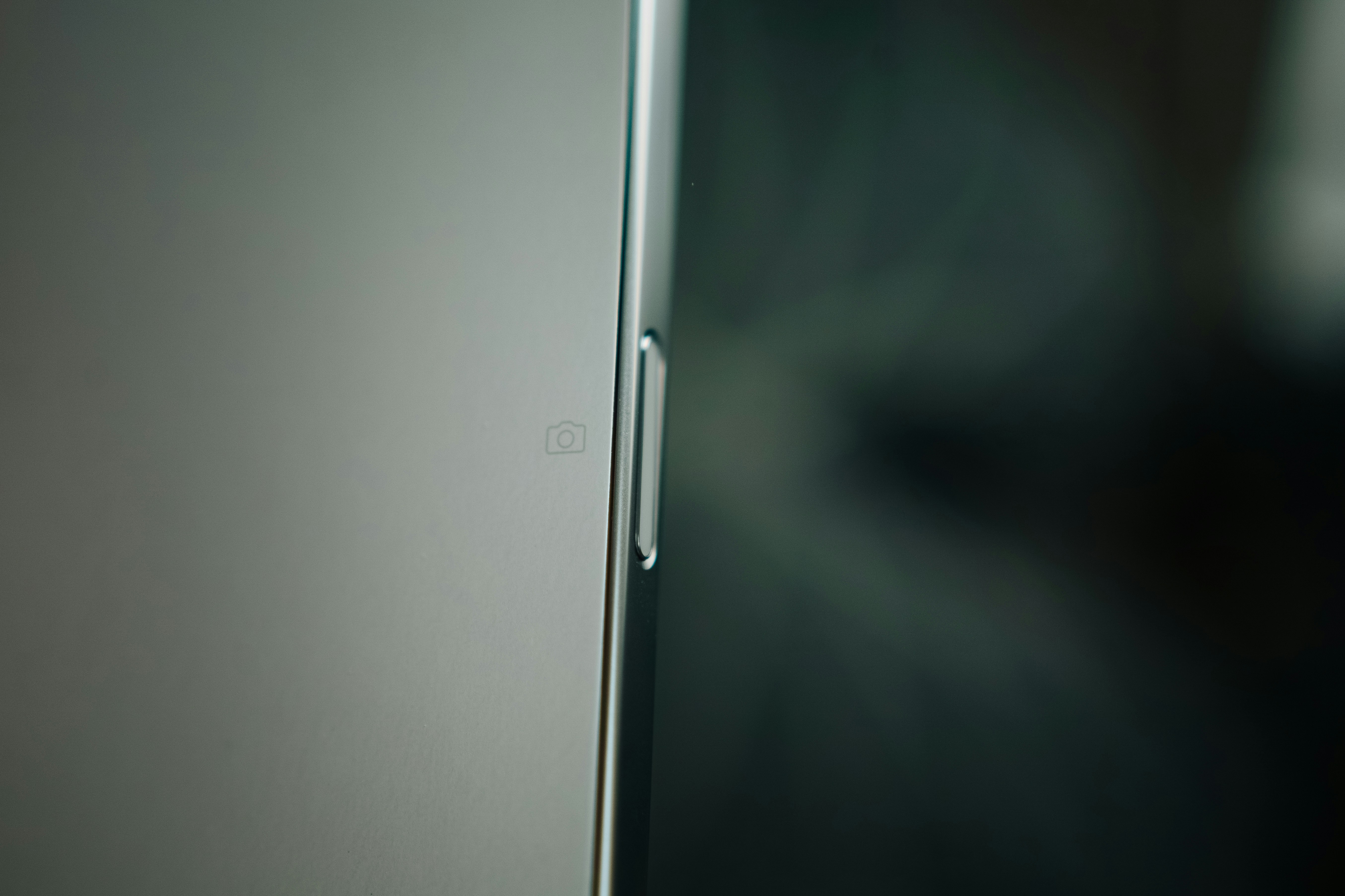 A close up of a door with a blurry background