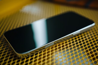 A close up of a cell phone on a table