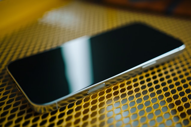 A close up of a cell phone on a table
