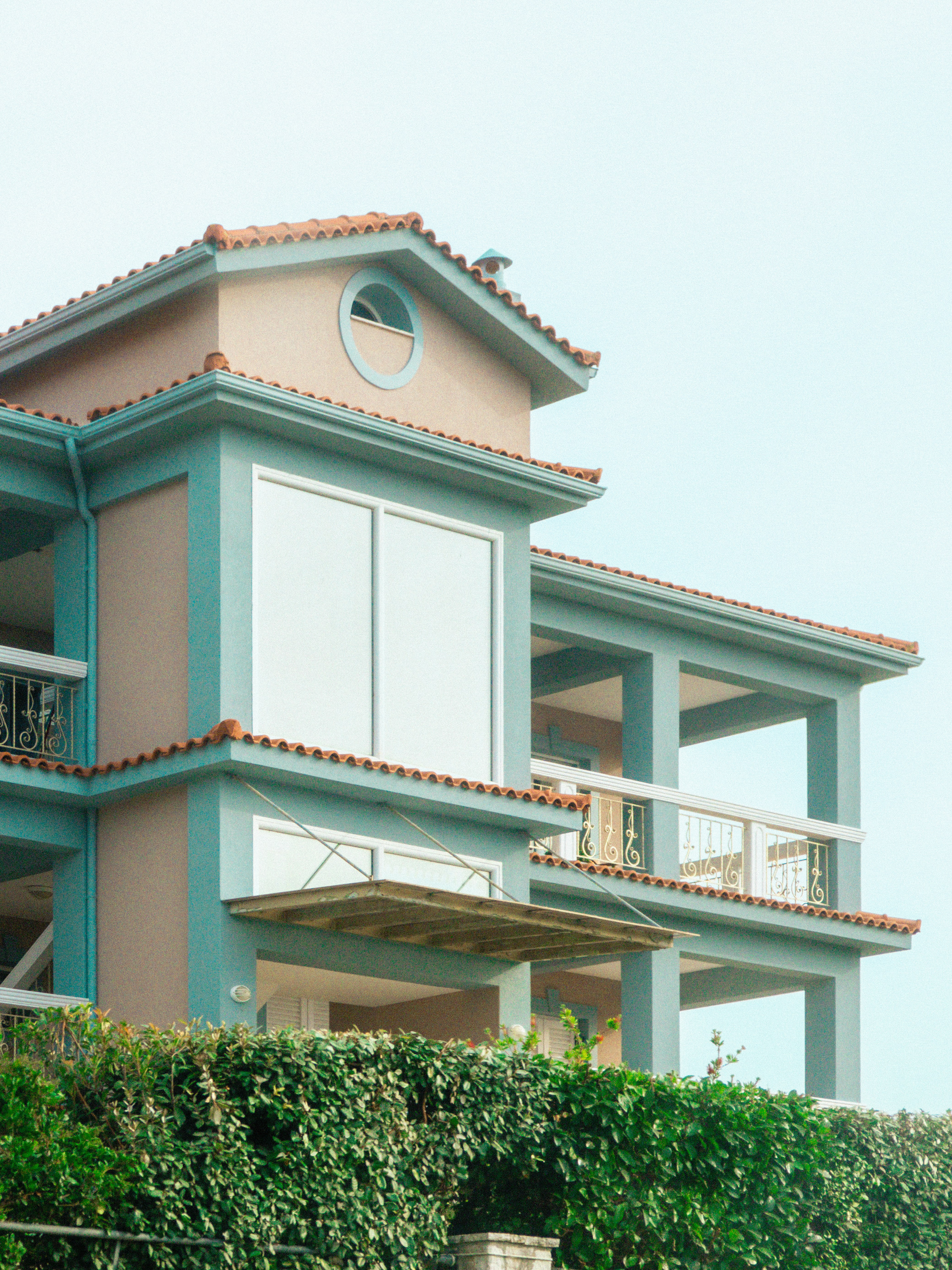 Contemporary home exterior with teal accent details