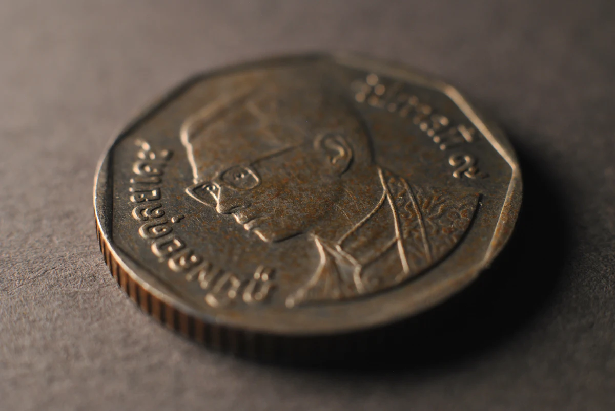 Close-up of coins on a table, representing currency and central bank finance