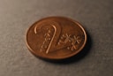 A close up of a penny on a table