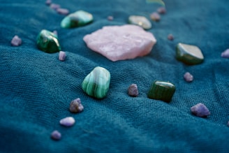 A close up of rocks and stones on a blue surface